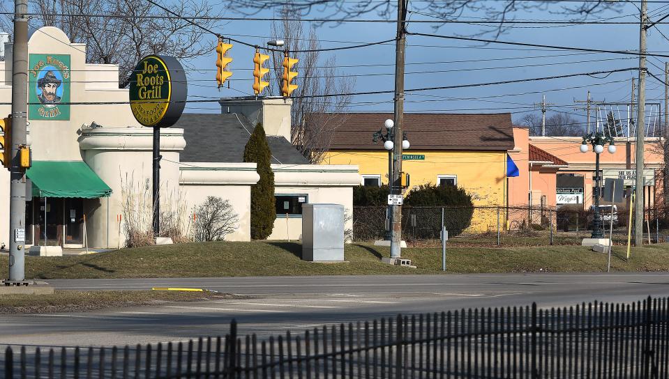 Three properties and buildings purchased by the Millcreek Township General Authority are shown near the intersection of West Eighth Street and Peninsula Drive on Feb. 9. From left to right are the former Joe Root's Grill, Grasshopper retail space and the vacant Bel-Aire Hotel. Two other properties on the south side of Eighth Street, opposite this view, were also purchased.