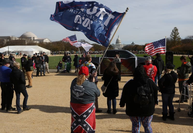 Militia members and pro-gun rights activists participating in the "Declaration of Restoration" rally listen to speakers in Washington, D.C.