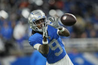 FILE - Detroit Lions wide receiver Jameson Williams warms up before the first half of an NFL football game against the Chicago Bears, Sunday, Jan. 1, 2023, in Detroit. The NFL has suspended five players for violating the league’s gambling policy on Friday, April 21, 2023. Detroit Lions wide receiver Quintez Cephus and safety C.J. Moore and Washington Commanders defensive end Shaka Toney were suspended indefinitely, while Lions wide receivers Stanley Berryhill and Jameson Williams have been suspended six games.(AP Photo/Paul Sancya, File)