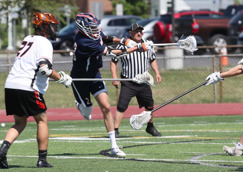 Briarcliff's Elliot Jone (23) fires a shot against Schuylerville during the boys lacrosse Class D regional final at Shaker High School in Albany June 4, 2022.  Briarcliff won the game 14-2.