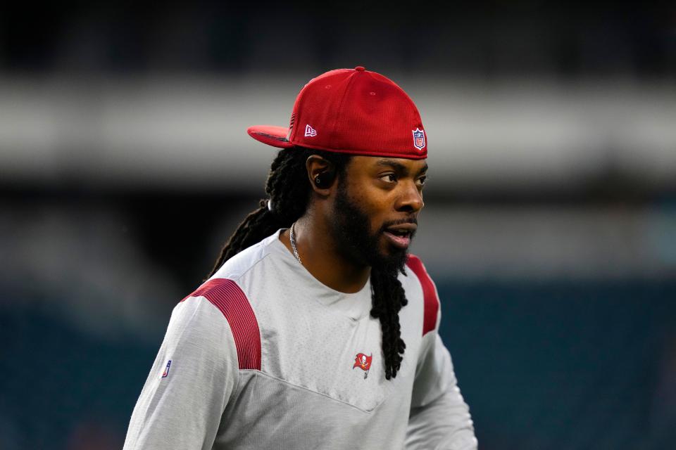 Richard Sherman warms up before the Buccaneers' game against the Eagles on Thursday night.