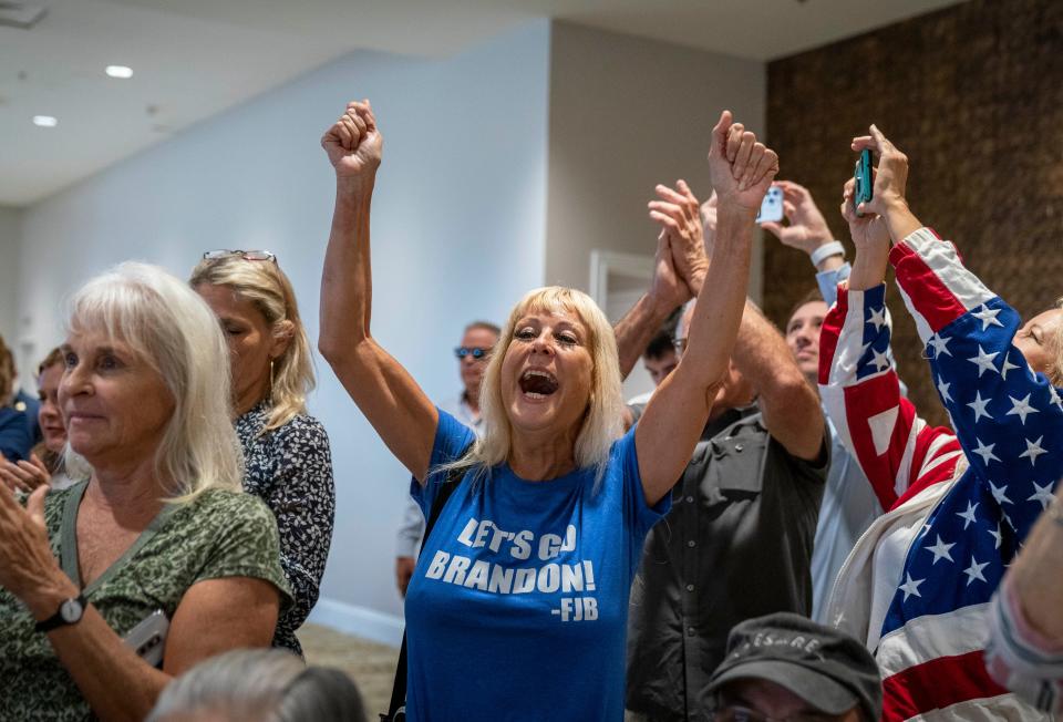 Supporters cheer for Florida Governor Ron DeSantis during his speech at the Hilton Palm Beach Airport hotel in West Palm Beach, Florida on November 3, 2021. 