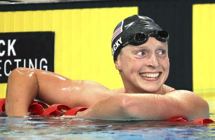 Katie Ledecky smiles after she set a world record in the women's 1500m freestyle in August 2014. (AP)