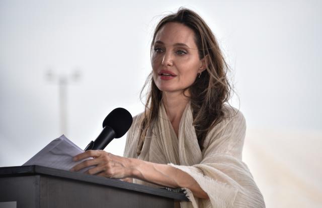 Angelina Jolie mingles with bargain shoppers at H&M on London's