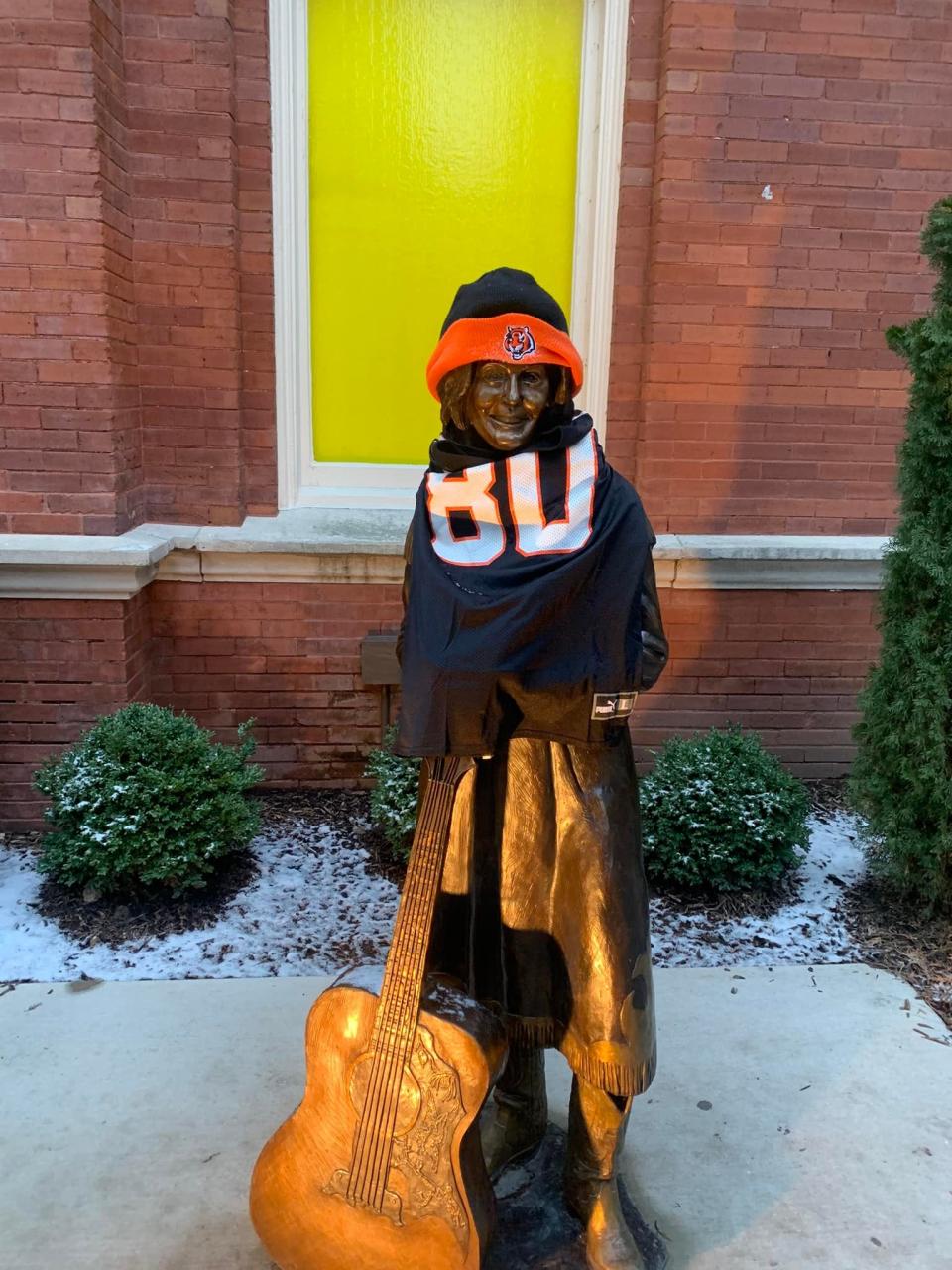 The Loretta Lynn statue outside the Ryman Auditorium decorated with Cincinnati Bengals gear.