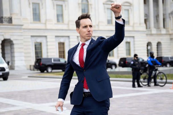 PHOTO: Sen. Josh Hawley gestures toward a crowd of supporters of President Donald Trump gathered outside the U.S. Capitol to protest the certification of President-elect Joe Biden's electoral college victory Jan. 6, 2021. (Politico via AP, FILE)
