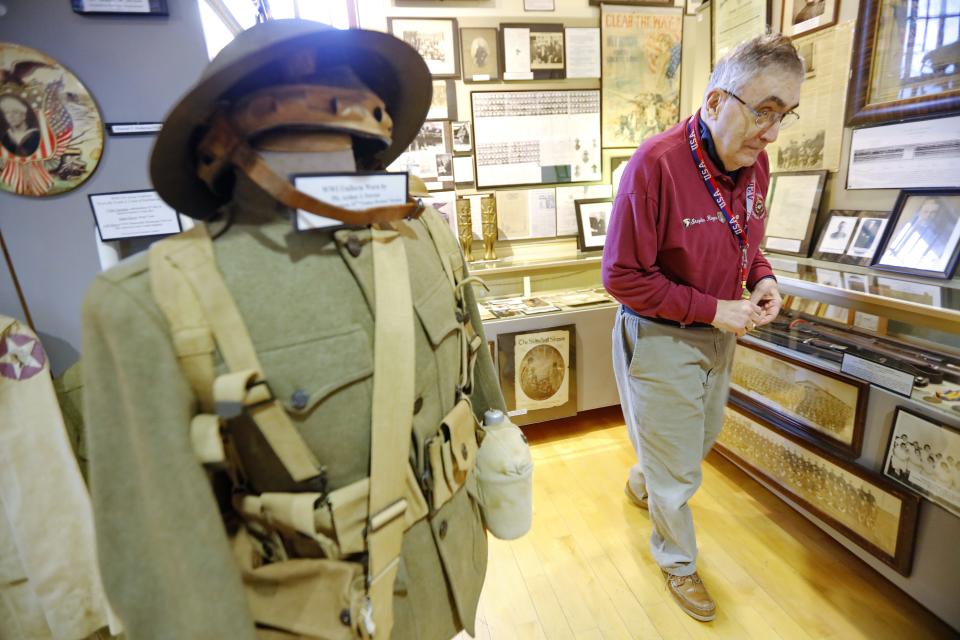 Korean War era Army veteran Stephen Rogers takes a walk past the WWI section of the Military Museum on Fort Taber Park in the south end of New Bedford.