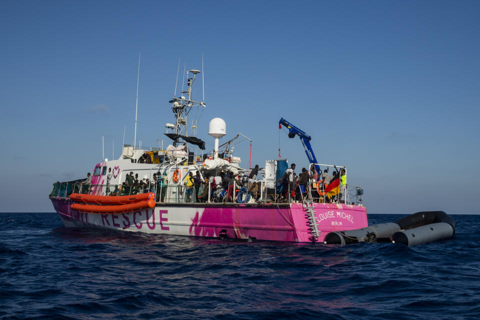 The Louise Michel rescue vessel with people rescued on board, including pregnant women and children, and 1 dead body, after 2 rescue operations on the high seas in the past days, 70 miles south west Malta, Central Mediterranean sea, Saturday, Aug. 29, 2020. The crew of the boat, called the Louise Michel, has in recent days reported picking up several groups of migrants in the central Mediterranean in what appeared to be its maiden rescue voyage. (AP Photo/Santi Palacios)