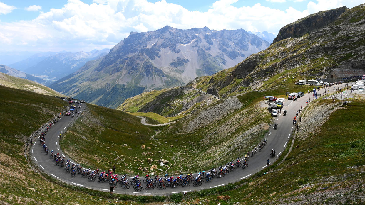  ALPE D'HUEZ, FRANCE - JULY 14: A general view of Simon Geschke of Germany and Team Cofidis Polka Dot Mountain Jersey, Tadej Pogacar of Slovenia and UAE Team Emirates white best young jersey, Wout Van Aert of Belgium Green Points Jersey, Jonas Vingegaard Rasmussen of Denmark and Team Jumbo - Visma Yellow Leader Jersey and the peloton compete beginning to climb the Col du Galibier (2619m) mountain landscape during the 109th Tour de France 2022, Stage 12 a 165,1km stage from BrianÃ§on to L'Alpe d'Huez 1471m / #TDF2022 / #WorldTour / on July 14, 2022 in Alpe d'Huez, France. (Photo by Tim de Waele/Getty Images) 