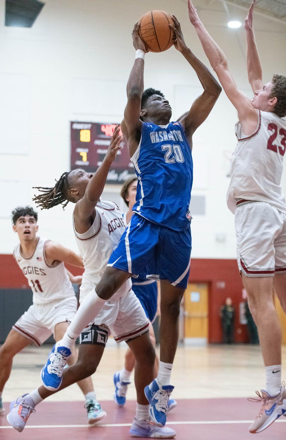 Gally Rich (20) shoots during the Booker T. Washington vs Tate boys basketball game at Tate High School on Thursday, Dec. 8, 2022.