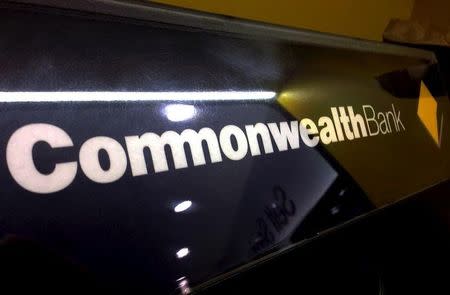A Commonwealth Bank of Australia logo adorns the wall of a branch in Sydney, Australia, November 5, 2015. REUTERS/David Gray/File Photo