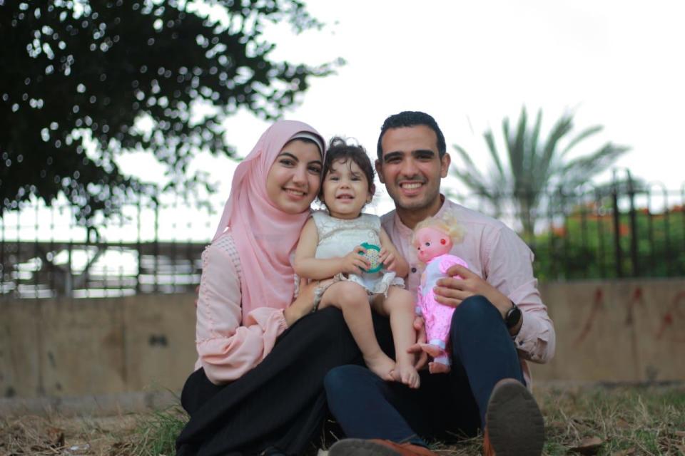 Roqaia Reda is seen in a family photo with her parents. / Credit: Courtesy of the Reda family