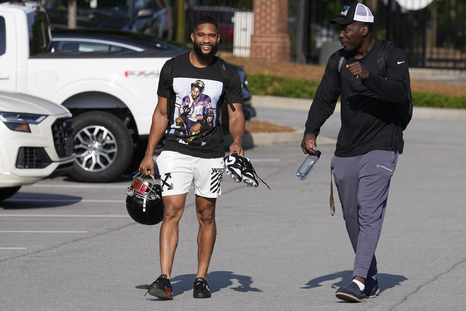 Atlanta Falcons wide receiver KhaDarel Hodge, left, and linebacker Adetokunbo Ogundeji report for the team's NFL football training camp Tuesday, July 25, 2023, in Flowery Branch, Ga. (AP Photo/John Bazemore)