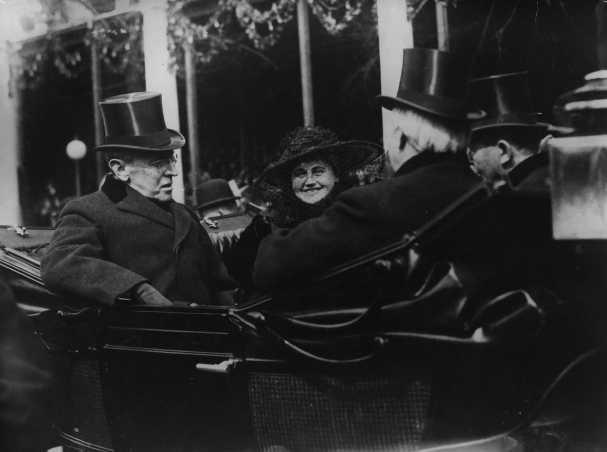 Edith Wilson smiles as she and husband Woodrow Wilson ride in the inaugural parade after he was sworn in for a second term in 1917.