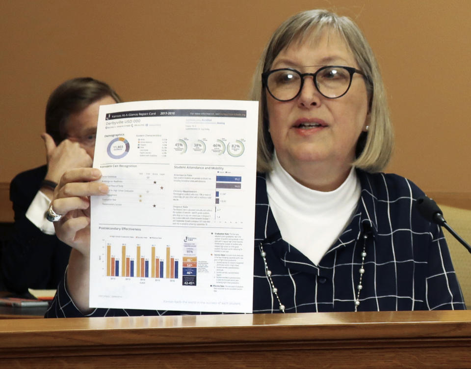 Kansas state Sen. Molly Baumgardner, R-Louisburg, explains the contents of a school funding and education policy bill during a meeting of fellow GOP senators, Thursday, April 4, 2019, at the Statehouse in Topeka, Kansas. The Kansas Supreme Court has said the state isn't spending enough money on its public schools and the state has until April 15, 2019, to file a report with the court on how lawmakers responded. (AP Photo/John Hanna)