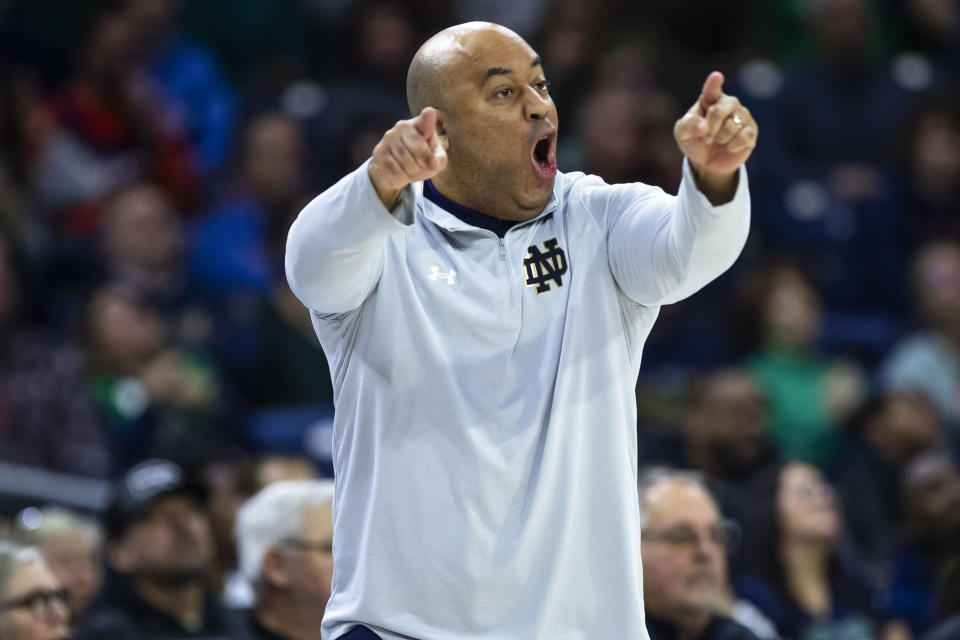 Notre Dame head coach Micah Shrewsberry shouts to his players during the first half of an NCAA college basketball game against Virginia on Saturday, Dec. 30, 2023, in South Bend, Ind. (AP Photo/Michael Caterina)
