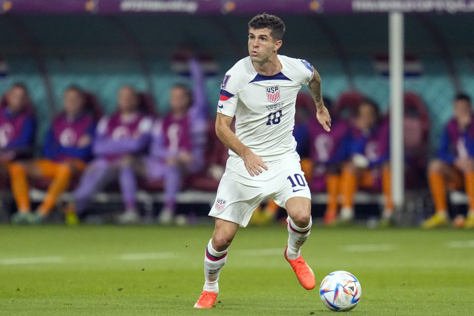 FILE - Christian Pulisic of the United States controls the ball during the World Cup round of 16 soccer match between the Netherlands and the United States, at the Khalifa International Stadium in Doha, Qatar, Saturday, Dec. 3, 2022. Pulisic just had one of his best seasons in Europe, scoring 12 goals with nine assists in Italy for AC Milan. (AP Photo/Ashley Landis, File)