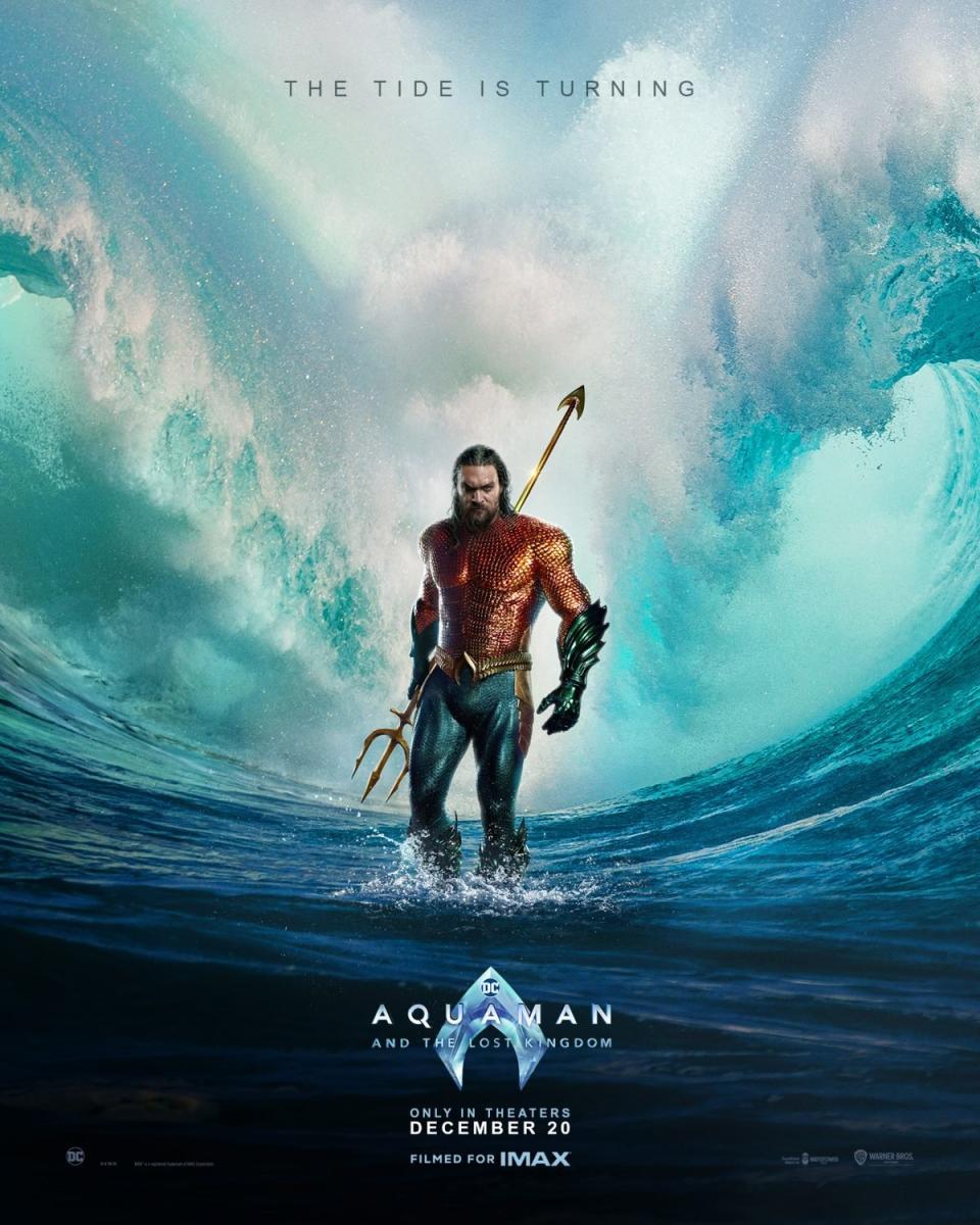 Poster for Aquaman: The Lost Kingdom depicts Arthur Curry (Jason Momoa) standing between two tidal waves. The text above says "The Tide Is Turning."