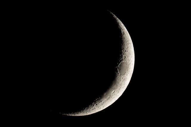 <p>Darwin Fan/Getty</p> Waxing crescent