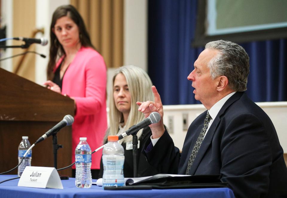 KHSAA Director Julian Tackett speaks during the Safer Sidelines discussion on May 17, 2023. The event was moderated by Stephanie Kuzydym (left) of The Courier Journal. Panelist Alma Mattocks, director of the athletic trainer program at Spalding University, is also pictured.