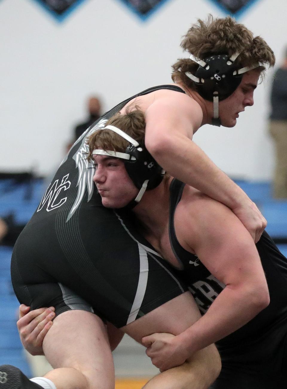 Perry's Logan Shephard, facing, takes down Westerville Central's Josiah Mair during their 220 pound match in the Division I OHSAA State Wrestling Tournament at Hilliard Darby High School, Saturday, March 13, 2021, in Hilliard, Ohio. [Jeff Lange/Beacon Journal]