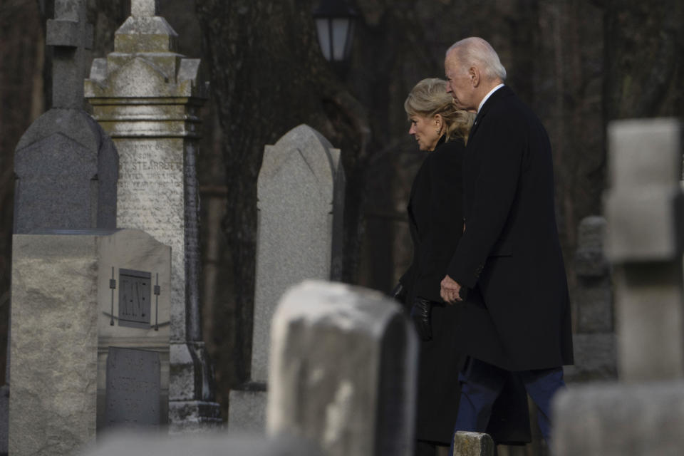 President Joe Biden and first lady Jill Biden walk between tombstones to attend Mass at St. Joseph on the Brandywine Catholic Church in Wilmington, Del., on Sunday, Dec. 18, 2022. / Credit: Manuel Balce Ceneta / AP