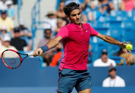 Aug 22, 2015; Cincinnati, OH, USA; Roger Federer (SUI) returns a shot against Andy Murray (not pictured) in the semifinals during the Western and Southern Open tennis tournament at the Linder Family Tennis Center. Mandatory Credit: Aaron Doster-USA TODAY Sports