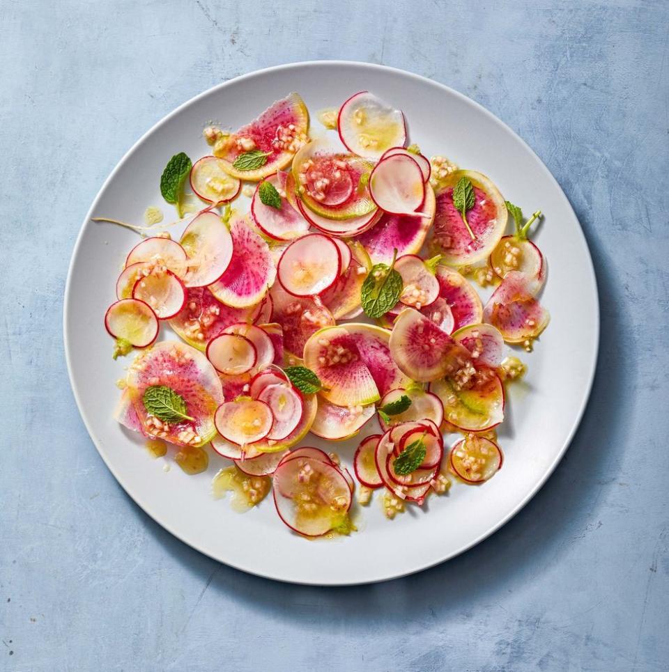 <p>This salad is so beautiful it's a centerpiece all on its own! Thinly slice a variety of radishes for this stunning and colorful side dish. </p><p>Get the <strong><a href="https://www.goodhousekeeping.com/food-recipes/healthy/a39495099/radish-salad-recipe/" rel="nofollow noopener" target="_blank" data-ylk="slk:Bright Radish Salad recipe;elm:context_link;itc:0;sec:content-canvas" class="link ">Bright Radish Salad recipe</a></strong>. </p>