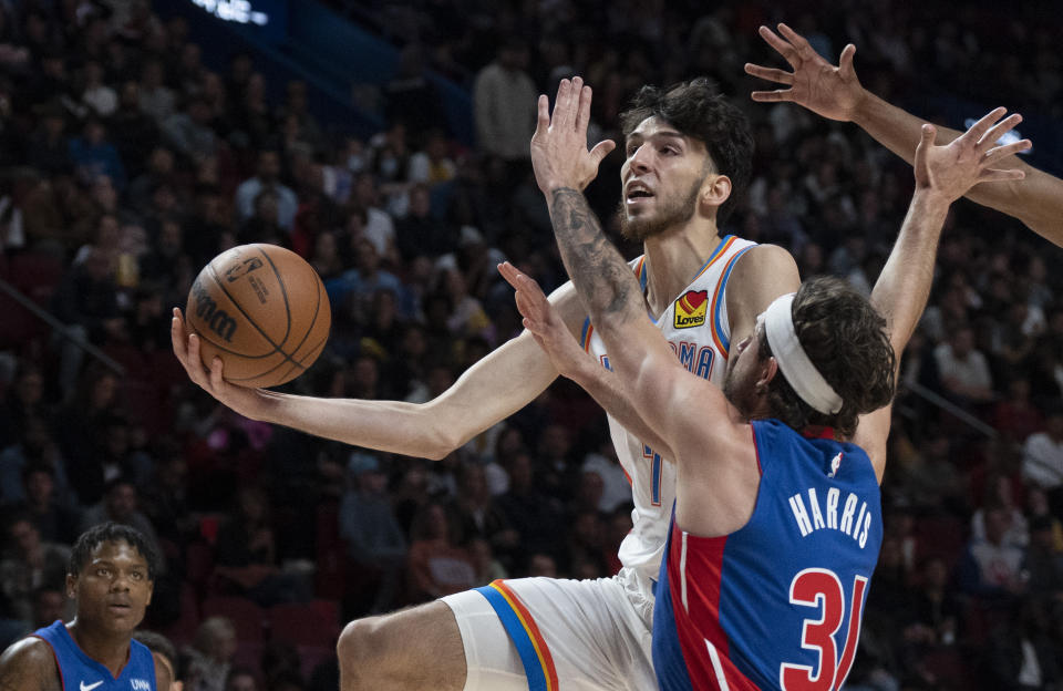 Oklahoma City Thunder's Chet Holmgren (7) goes to the basket against Detroit Pistons' Joe Harris (31) during the first half of an NBA preseason basketball game Thursday, Oct. 12, 2023, in Montreal. (Christinne Muschi/The Canadian Press via AP)