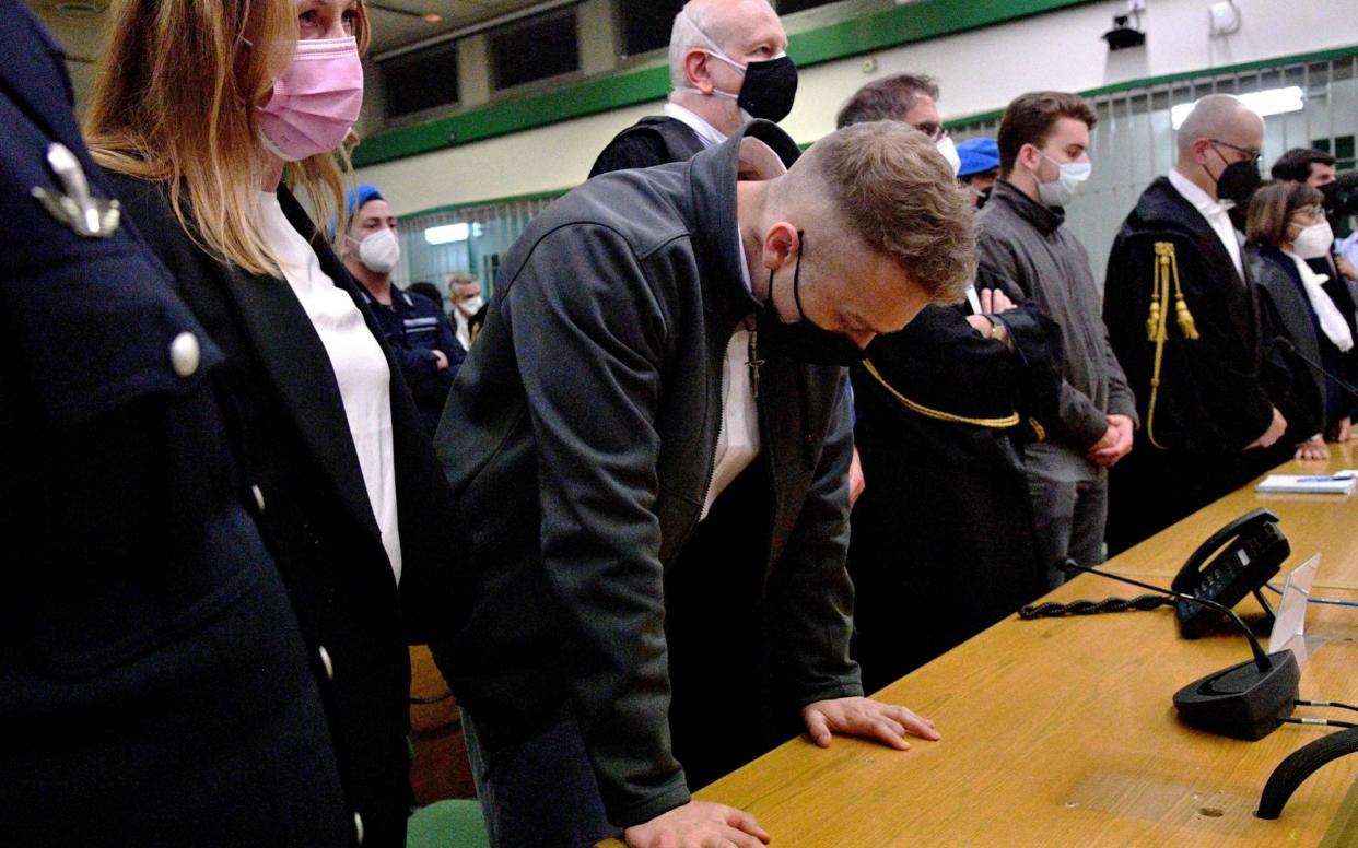 US citizen Finnegan Lee Elder (C) reacts after the court decision on May 5, 2021, during his trial - TIZIANA FABI /AFP