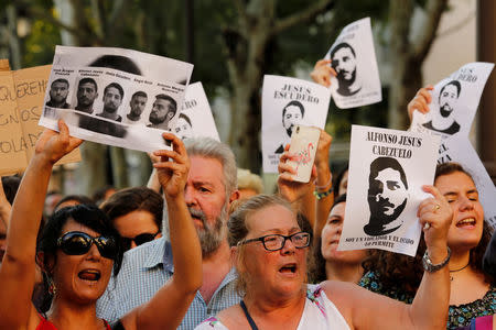 Protesters chant slogans during a demonstration against the release on bail of five men known as the "Wolf Pack" cleared of gang rape of a teenager and convicted of a lesser crime of sexual abuse in Seville, Spain, June 22, 2018. REUTERS/Marcelo del Pozo