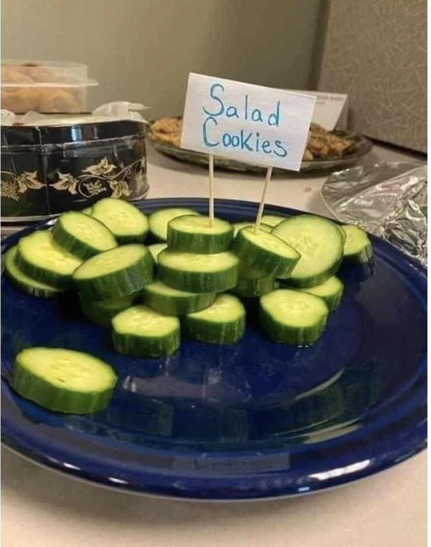 sliced cucumber pieces with the sign "salad cookies"