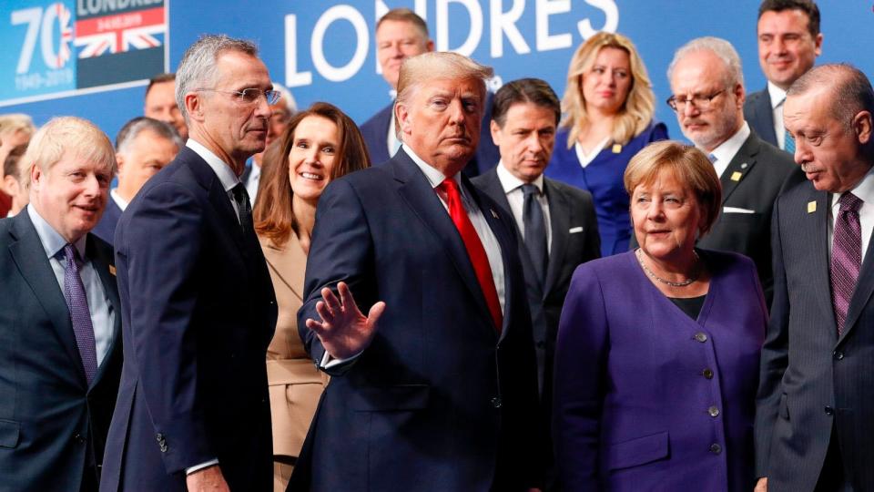PHOTO: President Donald Trump, center, gestures as he walks off the podium after a group photo at a NATO leaders meeting at The Grove hotel and resort in Watford, Hertfordshire, England, Dec. 4, 2019.  (Peter Nicholls/AP)