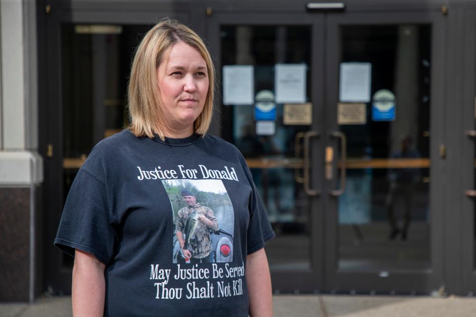 Melinda Mills, the sister of Donald Mills, stands outside U.S. District Court in London, Ky., following an arraignment hearing for Patrick Baker. Baker is accused of killing Donald Mills in 2014 in Knox County, but was pardoned by former Gov. Matt Bevin in 2019. Baker now faces federal charges on the same case and has a detention hearing scheduled for Friday at 1 p.m.. June 1, 2021