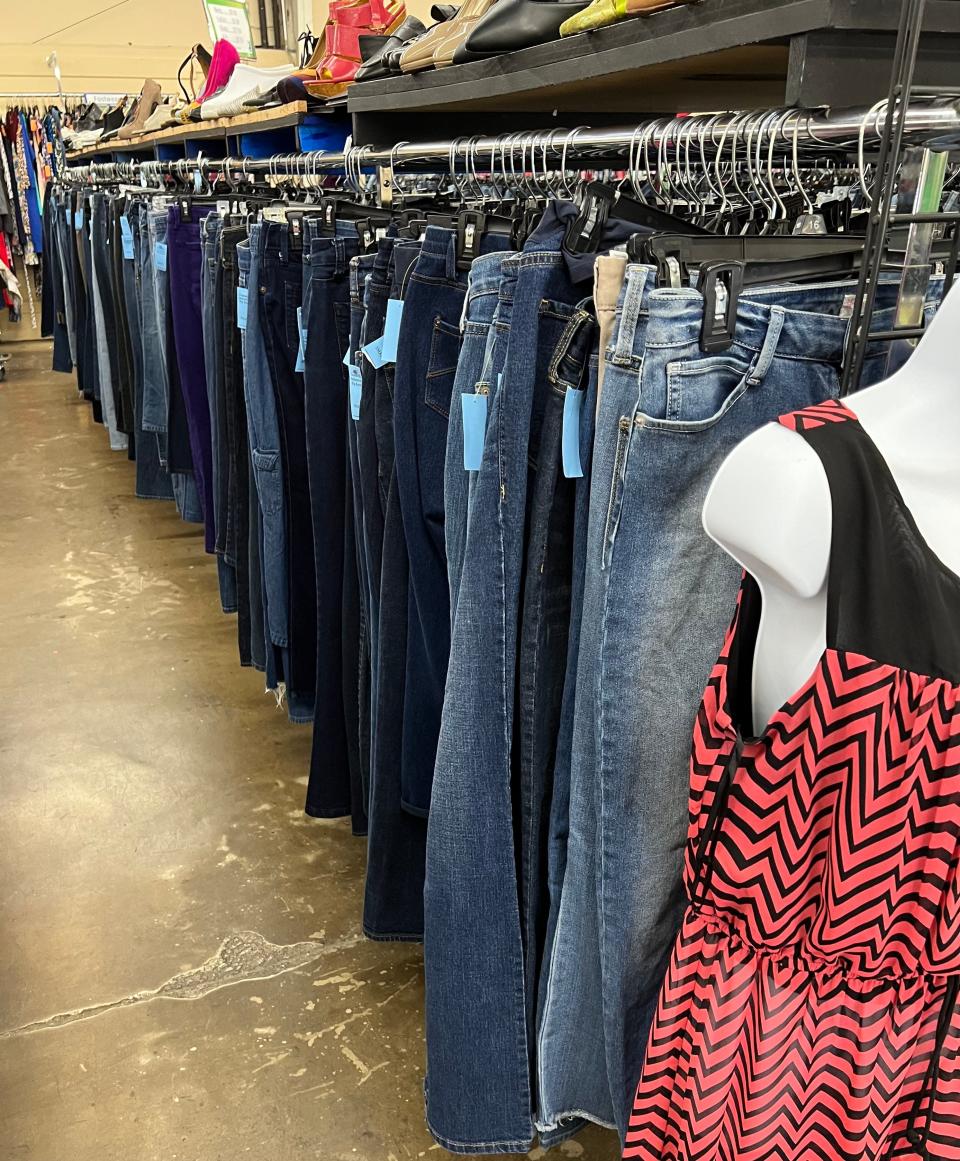 Checking out the jeans at Goodwill. Meta Calder
Shopping for jeans at Goodwill.