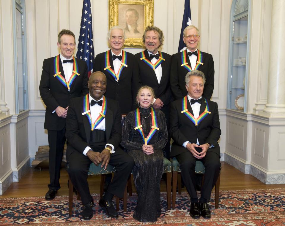 The 2012 Kennedy Center Honorees, from left, John Paul Jones, Buddy Guy, Jimmy Page, Natalia Makarova, Robert Plant, Dustin Hoffman, and David Letterman pose for a group photo after the State Department Dinner for the Kennedy Center Honors gala Saturday, Dec. 1, 2012 at the State Department in Washington. (AP Photo/Kevin Wolf)