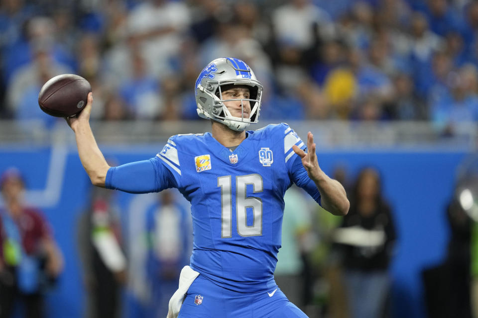 Detroit Lions quarterback Jared Goff (16) passes in the first half of an NFL football game against the Carolina Panthers in Detroit, Sunday, Oct. 8, 2023. (AP Photo/Paul Sancya)