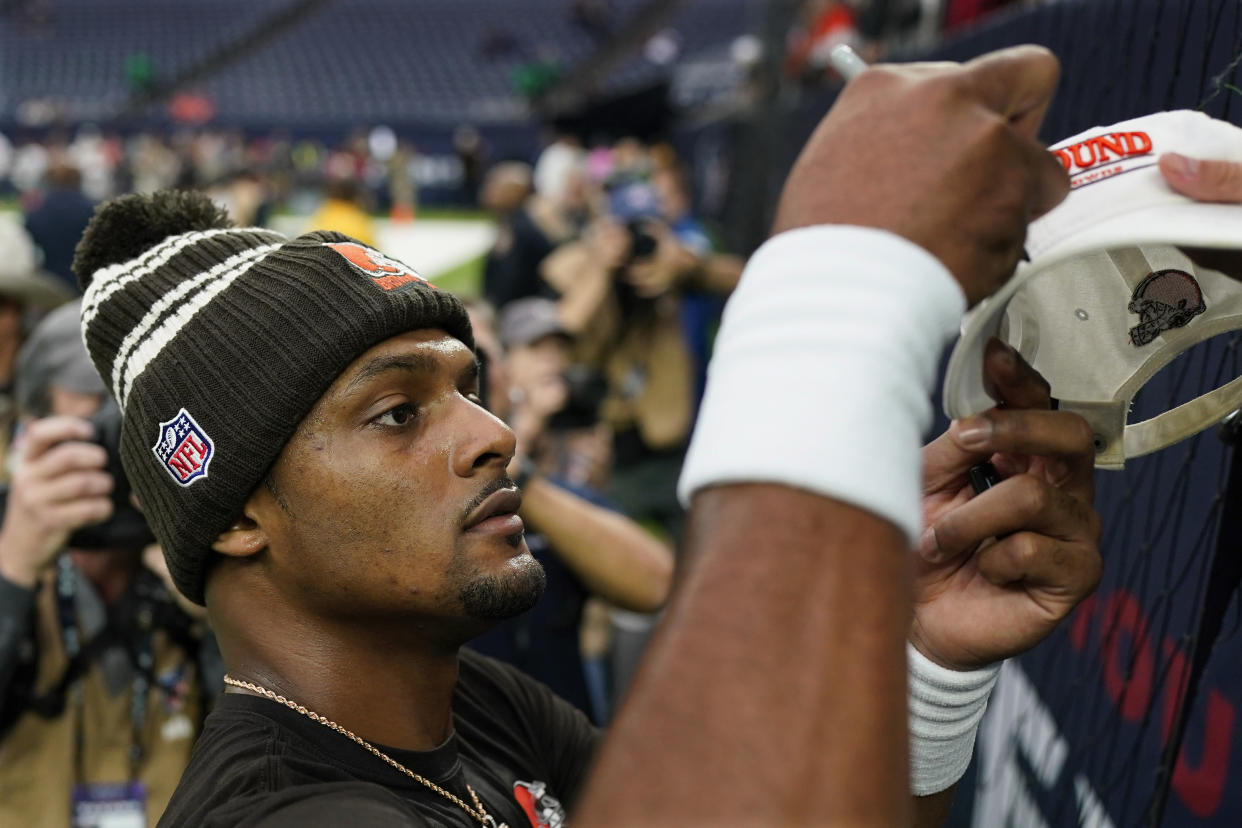 Cleveland Browns quarterback Deshaun Watson signs autographs before of an NFL football game between the Cleveland Browns and Houston Texans in Houston, Sunday, Dec. 4, 2022,. (AP Photo/Eric Gay)