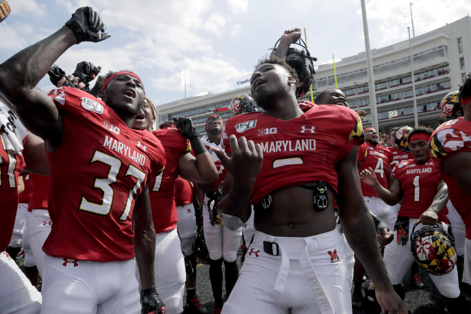 Maryland defensive back Lavonte Gater, left, and running back Tayon Fleet-Davis dance with teammates after they defeated Howard 79-0 in an NCAA college football game, Saturday, Aug. 31, 2019, in College Park, Md. (AP Photo/Julio Cortez)