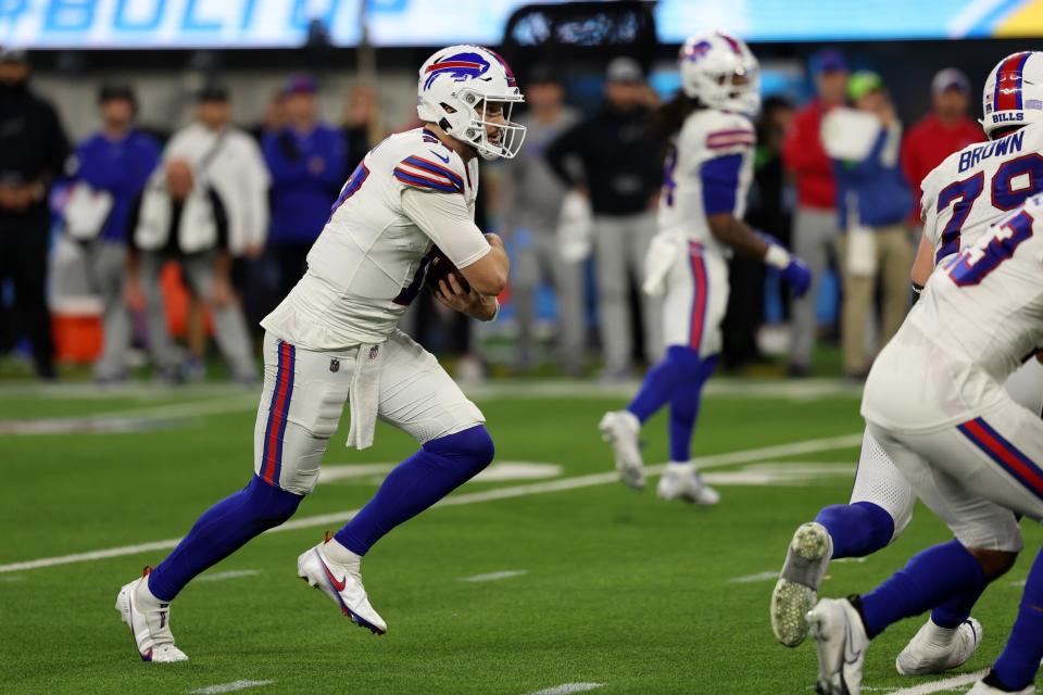 Dec 23, 2023; Inglewood, California, USA; Buffalo Bills quarterback Josh Allen (17) runs with the ball during the fourth quarter against the Los Angeles Chargers at SoFi Stadium. Mandatory Credit: Kiyoshi Mio-USA TODAY Sports