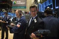 Traders work on the floor of the New York Stock Exchange April 15, 2014. REUTERS/Brendan McDermid