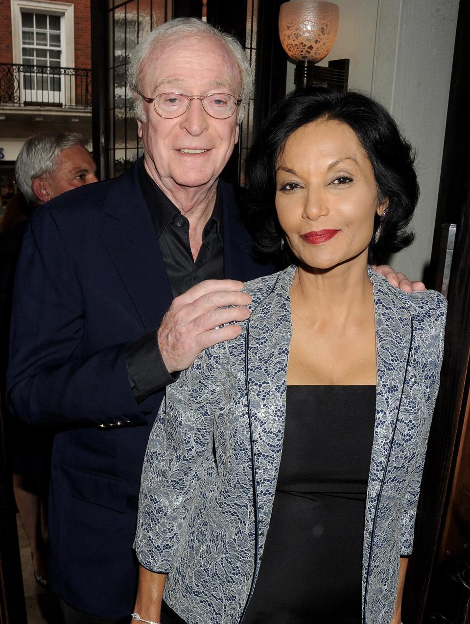 Sir Michael Caine (L) and Shakira Caine attend as Richard Caring and Sir Philip Green host Johnny Gold's 80th Birthday at 34 Grosvenor Square on June 25, 2012 in London, England