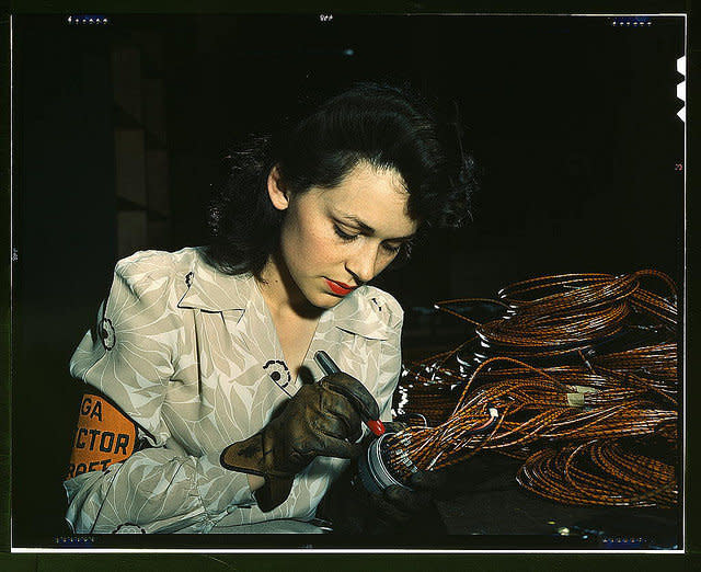 <p>Woman aircraft worker, Vega Aircraft Corporation, Burbank, Calif. Shown checking electrical assemblies.</p>