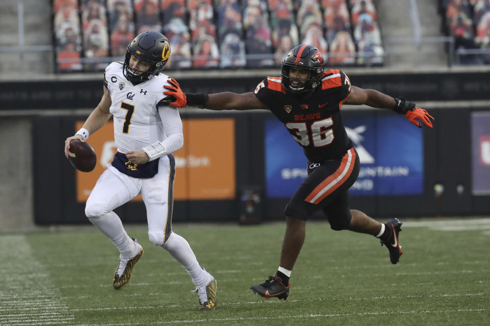 Oregon State inside linebacker Omar Speights (36) pushes California quarterback Chase Garbers (7) out of bounds during the second half of an NCAA college football game in Corvallis, Ore., Saturday, Nov. 21, 2020. Oregon State won 31-27. (AP Photo/Amanda Loman)