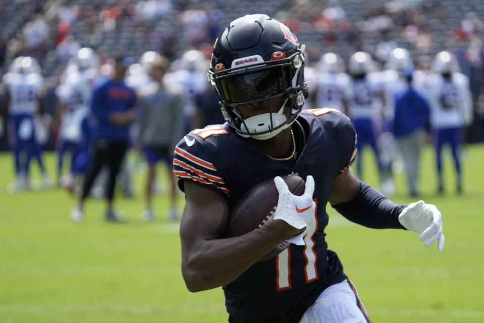 Chicago Bears’ Darnell Mooney makes a catch before an NFL preseason football game against the <a class="link " href="https://sports.yahoo.com/nfl/teams/buffalo/" data-i13n="sec:content-canvas;subsec:anchor_text;elm:context_link" data-ylk="slk:Buffalo Bills;sec:content-canvas;subsec:anchor_text;elm:context_link;itc:0">Buffalo Bills</a>, Saturday, Aug. 26, 2023, in Chicago. (AP Photo/Nam Y. Huh) ORG XMIT: INDC109