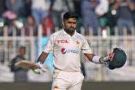 Pakistan's Babar Azam celebrates after scoring century during the third day of the first test cricket match between Pakistan and England, in Rawalpindi, Pakistan, Saturday, Dec. 3, 2022. (AP Photo/Anjum Naveed)