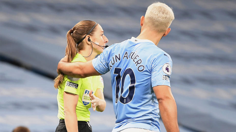 Sergio Aguero (pictured right) putting his arm around Assistant referee Sian Massey-Ellis (pictured left) at Etihad Stadium.