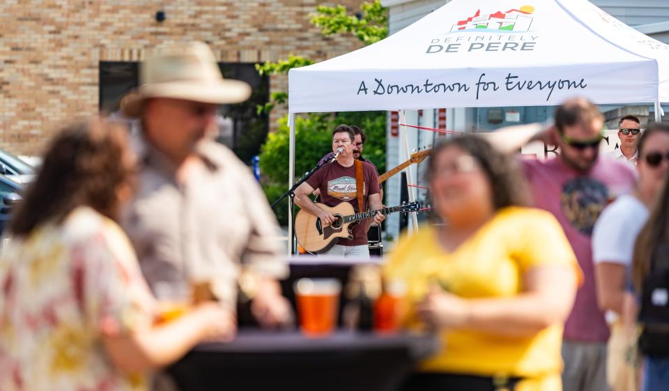 Steve Keeley plays music at the Downtown De Pere Farmers Market in 2023. He'll be back on Aug. 22 this year.
