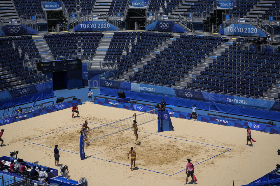 Brazil play against Argentina at the empty Shiokaze Park during a women's beach volleyball match at the 2020 Summer Olympics, Saturday, July 24, 2021, in Tokyo, Japan. (AP Photo/Petros Giannakouris)