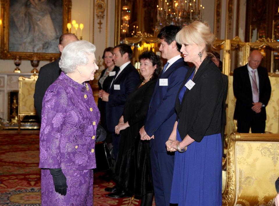Queen Elizabeth II meets Joanna Lumley during a Reception for Contemporary British Poetry at Buckingham Palace, London (Gareth Fuller/PA) (PA Archive)